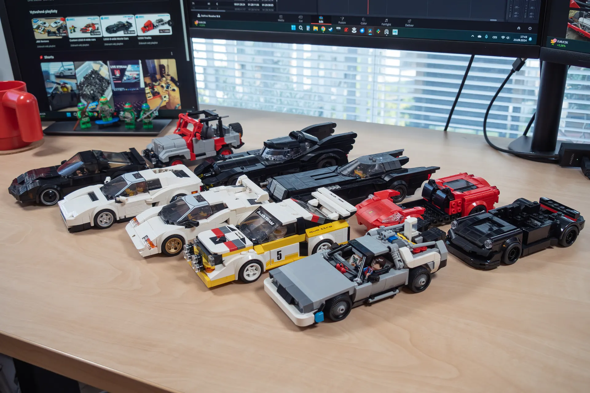 Lineup of custom Speed Champions scale LEGO cars on the desk
